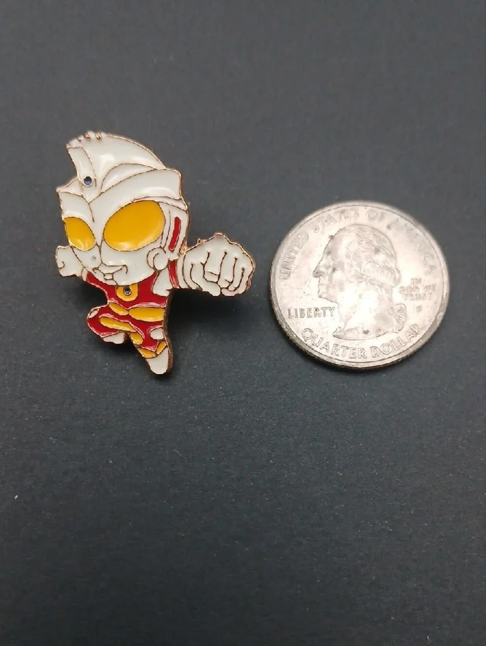 This is a chibi-style Ultraman enamel lapel pin